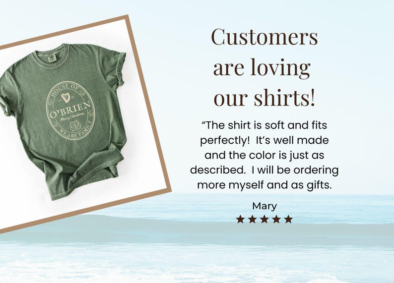May include: Green t-shirt with a crew neck and rolled sleeves. The shirt features an oval design with the text "HOUSE OF O'BRIEN" and "WE ARE FAMILY". The shirt is displayed on a white background.