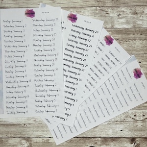 May include: Multiple white sticker sheets with dates and days of the week printed in black. The sheets are labelled with the text "YS-353-A", "YS-353-B", "YS-353-C", and "YS-353-E". Each sheet has a purple watercolour design.