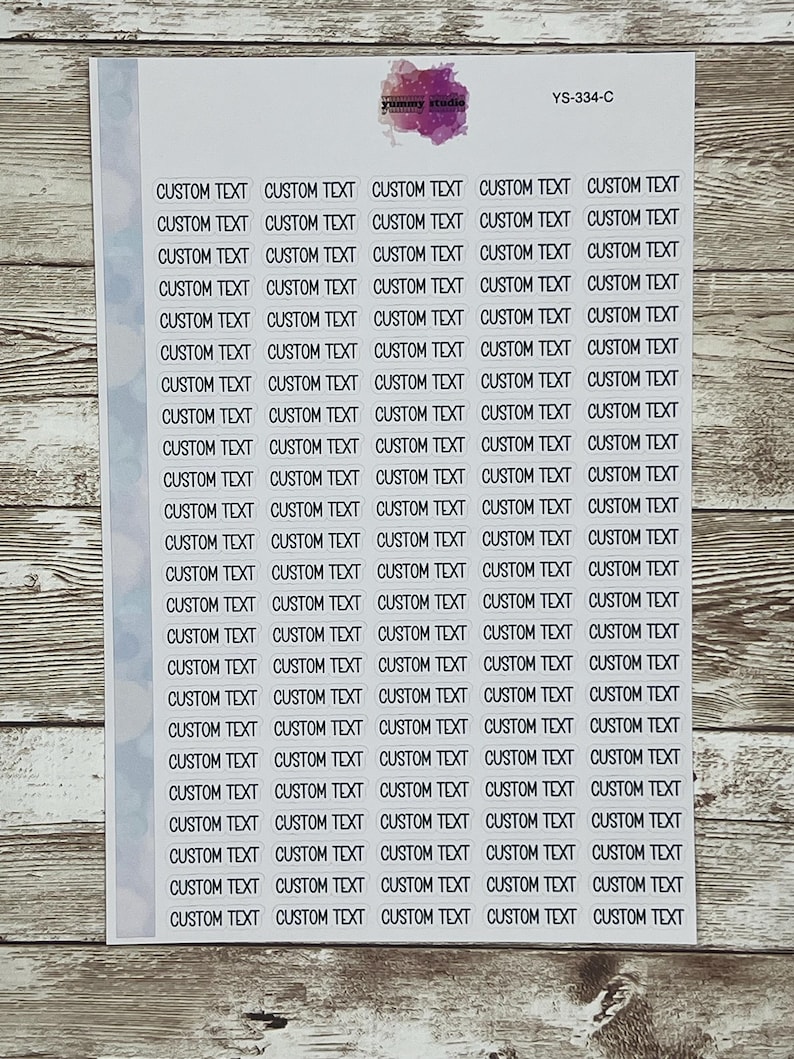 May include: A sheet of white sticker paper with 30 blank white rectangular stickers. Each sticker has the text "CUSTOM TEXT" printed in black.