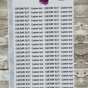 May include: A sheet of white sticker paper with 20 rows of black text that reads "CUSTOM TEXT" in a handwritten font. The text is repeated twice on each row, with the second instance of the text in lowercase.