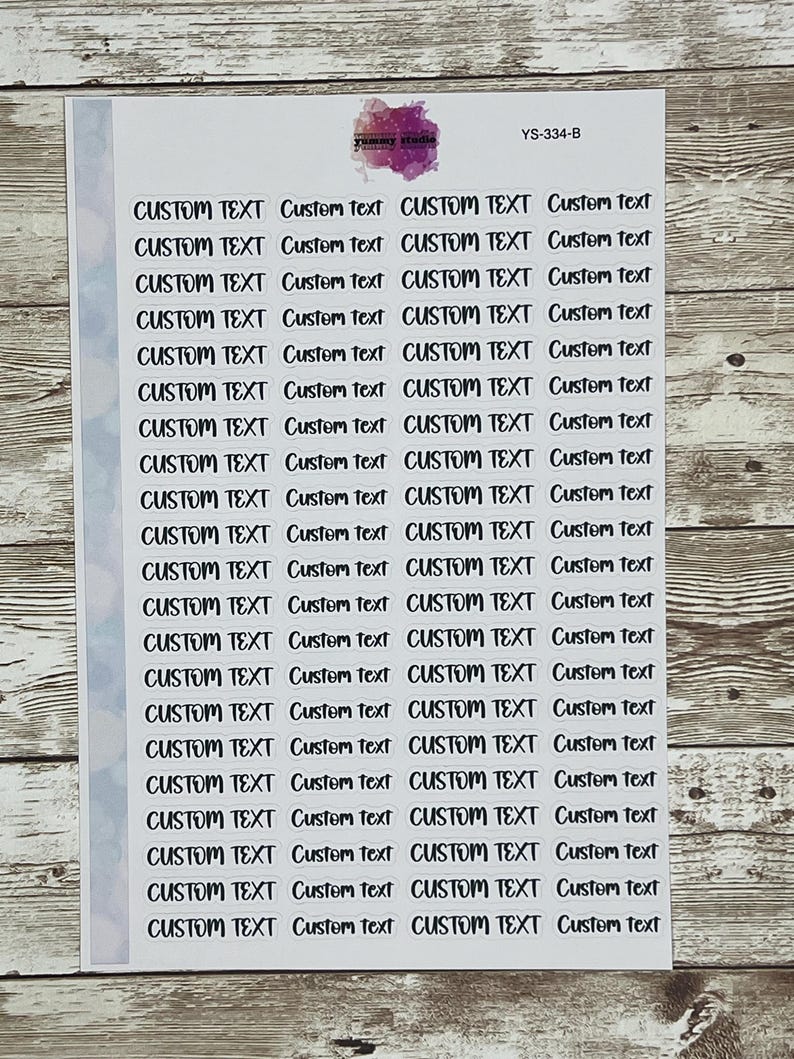 May include: A sheet of white sticker paper with 20 rows of black text that reads "CUSTOM TEXT" in a handwritten font. The text is repeated twice on each row, with the second instance of the text in lowercase.
