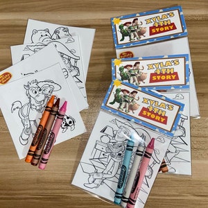 May include: A set of colouring pages featuring characters from the Toy Story movie franchise. The pages are packaged in clear plastic bags with a header that reads "XYLA'S 4TH STORY". The set includes crayons.