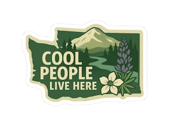 May include: A sticker in the shape of Washington state with the text "COOL PEOPLE LIVE HERE." The sticker features a mountain, river, trees, a flower, and a purple plant. The background is green.