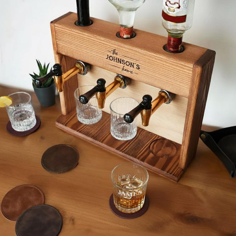 A wooden bar cart with three glass taps, displaying various drinks, and a few coasters on a wooden table.