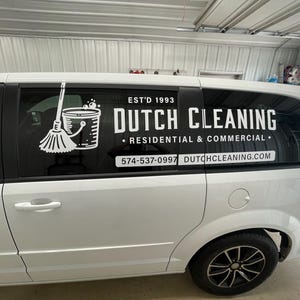May include: White van with a black and white logo on the side that says "Dutch Cleaning" with the tagline "Residential & Commercial". The phone number 574-537-0997 and website dutchcleaning.com are also on the logo.