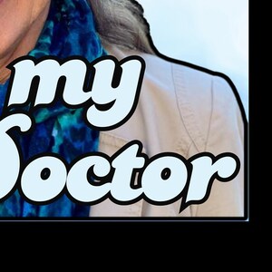May include: Image features the words "my Doctor" in a stylized, light blue font with a black outline. The text is superimposed over a person wearing a tan jacket and a blue and teal scarf.
