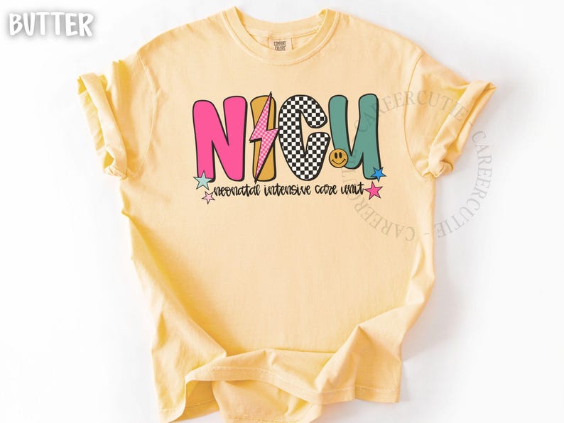 May include: Butter-colored t-shirt with the text "NICU" in colorful, retro-style letters. The design includes a lightning bolt, a checkered pattern, a smiley face, and stars. The words "neonatal intensive care unit" are below the main text.