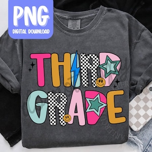 May include: A dark gray t-shirt with the words "THIRD GRADE" in colorful, playful lettering. The design includes a lightning bolt, stars, and smiley faces. A digital download graphic is in the upper left corner.