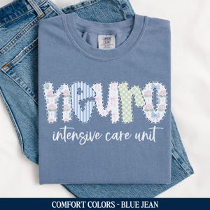 May include: A blue jean t-shirt with a patchwork design that says "Neuro Intensive Care Unit".