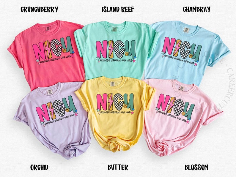 May include: Six colorful t-shirts in shades of pink, blue, yellow, and purple. Each shirt features the word "NICU" in a bold, multi-colored design with a lightning bolt and a smiley face. The shirts are labeled with their respective colors.