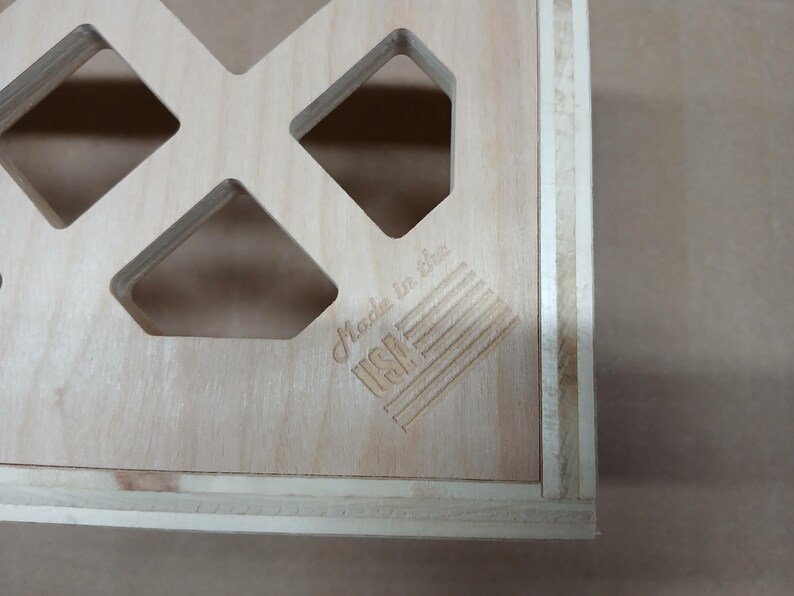 May include: A wooden box with a grid pattern and the text "Made in the USA" on the front.