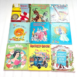 May include: Nine vintage children's books with colorful covers. Titles include "See-It Goes!", "Three Billy Goats Gruff", "Digger Dan", "The Lion's Haircut", "One Hundred and One Dalmatians", "Cinderella", "Snow White and the Seven Dwarfs", "Rackety-Boom", and "That's Where You Live!"