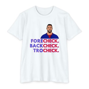 May include: White t-shirt with a cartoon illustration of a hockey player wearing a blue jersey with red and white accents. The text "FORECHECK. BACKCHECK. TROCHECK." is printed in red and blue on the shirt.