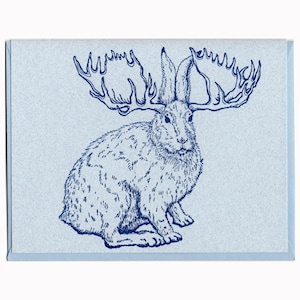 May include: A blue line drawing of a rabbit with large antlers on a light blue background.