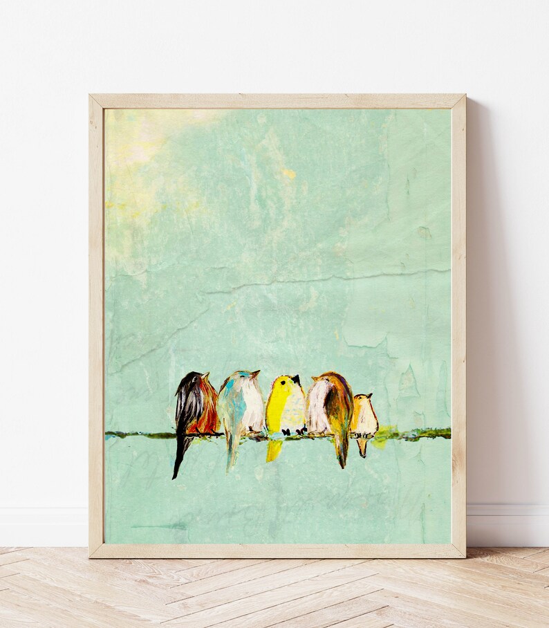 Five small birds sit close together on a wire. They each have different colored feathers representing a stylized Robin, Bluebird, Yellow Finch, sparrow, Wren. The birds are visually striking against the vivid yellow background of the art.