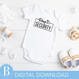 May include: White baby onesie with black text that reads "Ring Security" in a box with two rings inside.