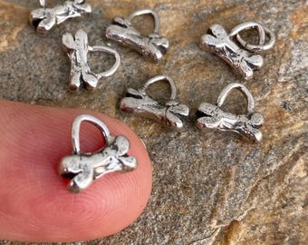 Dije artesanal de hueso de perro en plata de ley (UNO)