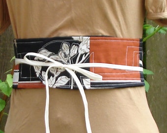 Wrap belt in tan, off-white and black with pocket size medium, large, extra large