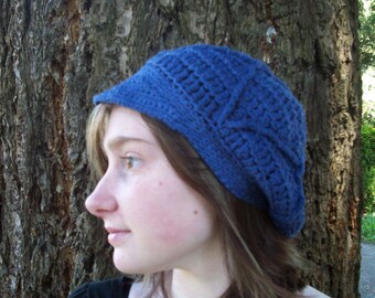 Hand-dyed navy blue crocheted newsie cap with a textured design