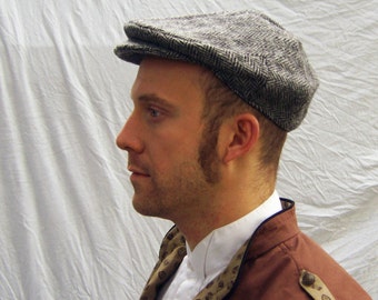 Flat cap in black and white herringbone tweed wool woven by Harris