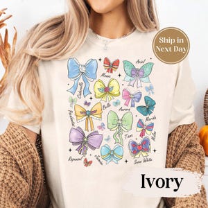 Watercolor Coquette Bows Disney Princess T-shirt, Disney Aurora Ariel Belle Cinderella Tiana Shirt,Magic Kingdom Disneyland Girl Tee 8190237