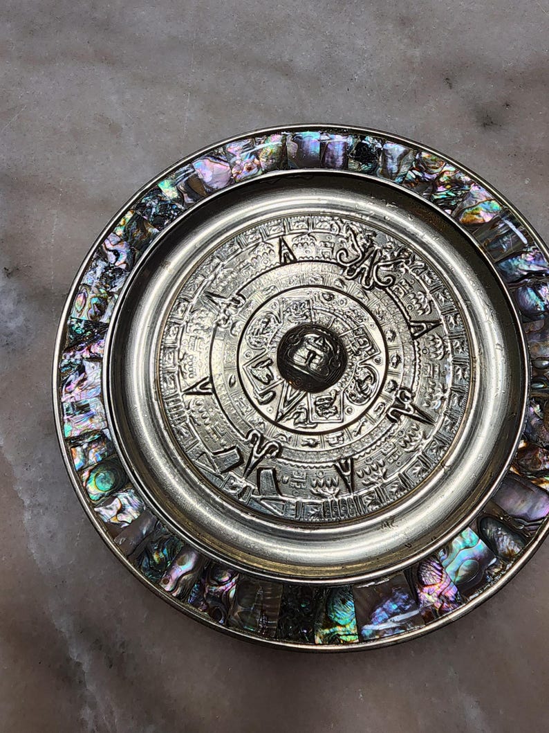 Decorative Plates Featuring the Aztec Calendar Stone Also Known as the ...