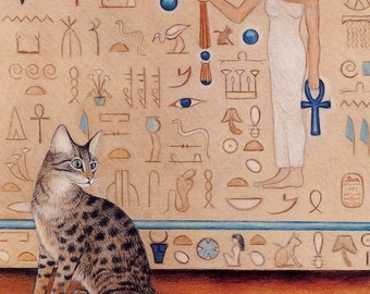 May include: A tabby cat sits on a ledge in front of a wall with Egyptian hieroglyphs and a woman with a cat head wearing a white dress and holding a blue ankh.
