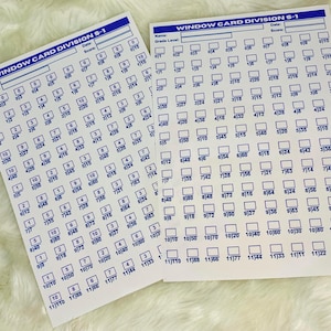 May include: Two white sheets of paper with blue text and borders. The sheets are labeled "Window Card Division S-1". Each sheet has a grid of 120 small squares, each with a number inside. The numbers range from 01 to 1199.