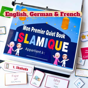 May include: A colorful quiet book titled "Mon Premier Quiet Book ISLAMIQUE" with illustrations of children and Islamic themes. Includes flashcards with Arabic and English text, and a binder with a metal ring.
