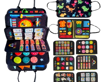 May include: A black felt activity board with multiple interactive elements for children. Features include a clock, color matching, shape sorting, and alphabet learning. Additional boards with dinosaur and weather themes are also shown.