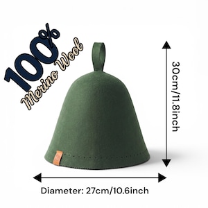 May include: A dark green felt sauna hat with a top hanging loop and a small brown leather tag. The hat is labelled 100% Merino Wool and measures 30 cm in height and 27 cm in diameter as indicated by the visible measurement markers on the image.