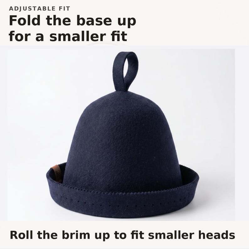 May include: A dark navy blue felt hat with a rounded crown, a small loop at the top, and a wide brim. The text above reads ADJUSTABLE FIT Fold the base up for a smaller fit, and the text below reads Roll the brim up to fit smaller heads.