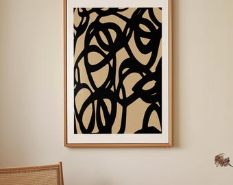May include: Abstract art print with black lines and shapes on a beige background. The print is framed in a light wood frame.