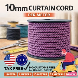 May include: A spool of 10mm purple curtain cord is the focal point, with the text "10mm CURTAIN CORD PER METER" above it. Other spools of cord in various colors are in the background. A yellow measuring tape and scissors are also visible. The image includes text about tax-free orders.