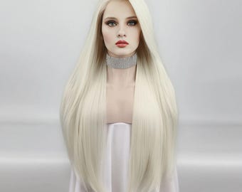 May include: A long, straight, platinum blonde wig with a lace front. The wig is styled with a center part and falls to the mid-chest. The model is wearing a rhinestone choker. The wig is displayed on a mannequin head.