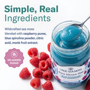 May include: A glass jar of blue sea moss gel with a spoon holding a portion, surrounded by fresh raspberries. The label reads True Sea Moss Sea Moss Gel Blue Spirulina and Raspberry Superfood 16 fl oz (1 pt) 453ml. Text includes Simple, Real Ingredients.