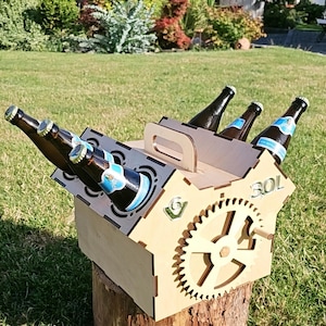 May include: Wooden beer carrier with a gear design and the word "30L" printed on the side. The carrier holds six bottles of beer.