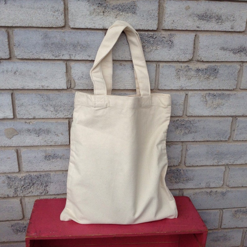 OM design on Unbleached canvas book bag Reusable carry bag