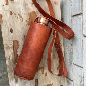 120BOTTLESTRAPLEA Leather bottle holder with straps - Small Leather Goods -  Maje.com