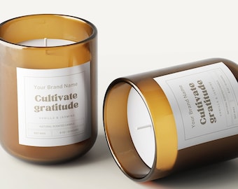 May include: Two amber glass candle jars with white labels. The labels have the text "Cultivate gratitude" and "Your Brand Name" in gold lettering.