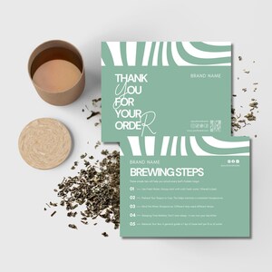 May include: A flat lay featuring a kraft paper cup and coaster, loose tea leaves, and two mint green cards. The cards have white wave designs and text that reads "Thank You For Your Order" and "Brewing Steps".