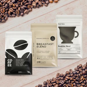 May include: Three coffee bean bags with different designs and text. One bag is black and white with the word "COFFEE" and coffee bean graphics. Another is beige with "BREAKFAST BLEND" text. The third bag has a coffee cup graphic.