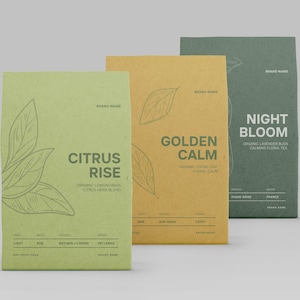 May include: Three tea packages in green, yellow, and dark green. The green package reads "Citrus Rise" with a leaf illustration. The yellow package reads "Golden Calm". The dark green package reads "Night Bloom".