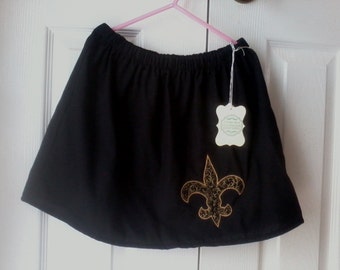 Girl's lined Saints inspired skirt, size 6/7, embroidered in  gold edge with fleur de lis of black with gold scrolls