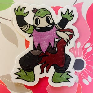 May include: A green and brown cartoon character with a pink beard and red claws. The character is wearing a black mask and has large eyes. The character is in a fighting pose.