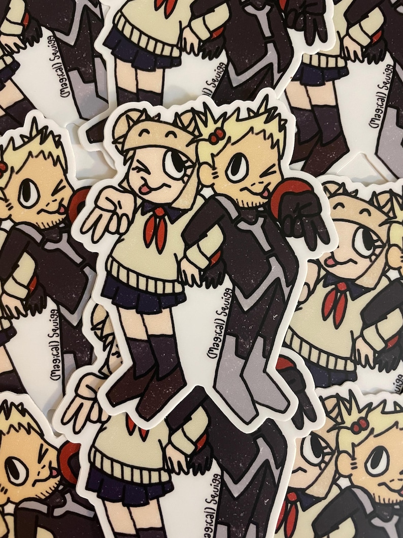 May include: Two cartoon characters, a girl with blonde hair and a boy with black hair, are wearing school uniforms. The girl is wearing a white shirt with a red bow and a black skirt. The boy is wearing a black shirt with a white collar and a black skirt. The characters are standing side by side and smiling. The background is a white surface with a pattern of black and white dots.