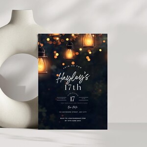 May include: A dark blue invitation with a photo of fairy lights hanging in a tree. The text reads "Join us for Hayley's 17th" with the date and time of the event. The invitation also includes the location and RSVP information.