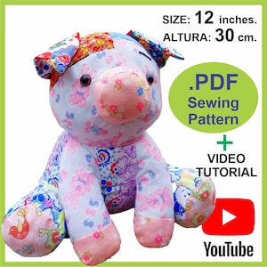 May include: A PDF sewing pattern for a 12-inch patchwork pig plushie. The pattern includes a video tutorial. The pig is sitting with its legs crossed and has a pink nose and ears.