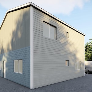 以下が含まれることがあります： グレーとブルーのサイディングを施した2階建ての建物。建物には窓がいくつかとドアがあります。建物は木々と白いバンに囲まれています。