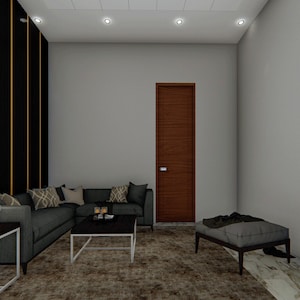 Puede incluir: Un sof&aacute; seccional gris con almohadas se encuentra en una sala de estar con una puerta marr&oacute;n, una otomana gris y una pared negra y dorada.